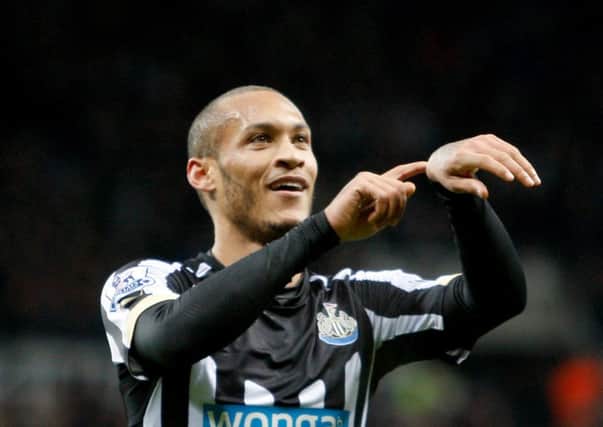 Newcastle United's Yoan Gouffran (left) celebrates scoring his sides first goal of the game during the Barclays Premier League match at St James' Park, Newcastle. PRESS ASSOCIATION Photo. Picture date: Saturday January 17, 2015. See PA story SOCCER Newcastle. Picture credit should read: Richard Sellers/PA Wire. RESTRICTIONS: Editorial use only. Maximum 45 images during a match. No video emulation or promotion as 'live'. No use in games, competitions, merchandise, betting or single club/player services. No use with unofficial audio, video, data, fixtures or club/league logos.
