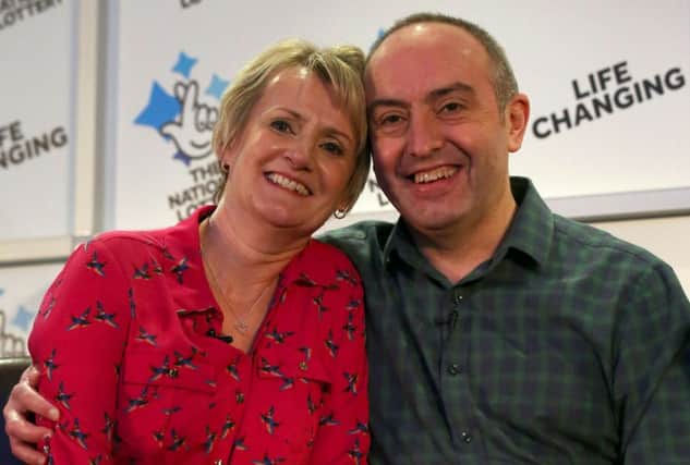 David and Carol Martin, a husband and wife from Hawick in the Scottish Borders, celebrate after winning half of Sunday's historic Â£66million Lotto jackpot. Picture by Andrew Milligan/PA Wire