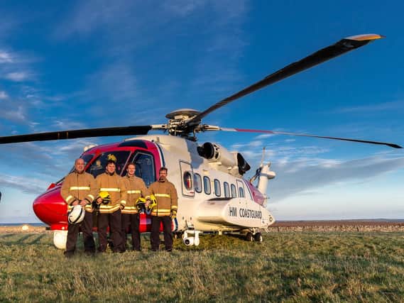 Fire service personnel with one of the new search and rescue helicopters.