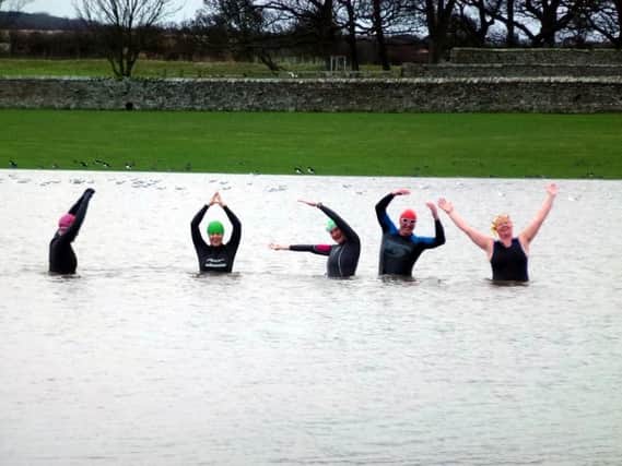 Alnwick Sea Swimmers in the flooded field. Picture by Eleanor Phillips