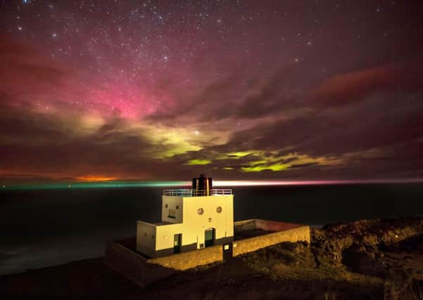 Jane Coltman's picture of the Aurora at Bamburgh lighthouse.