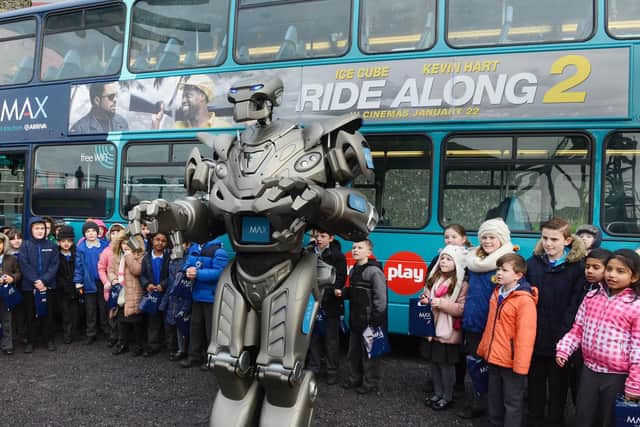 TITAN the robot helped launch the new Arriva X20 buses with children from St Aidan's RC School in Ashington. Picture by Jane Coltman