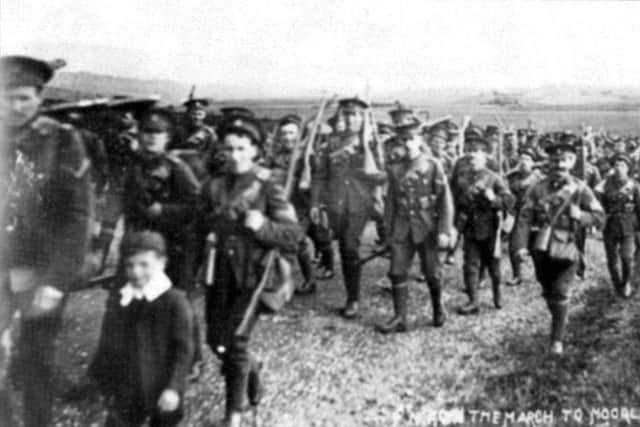 The 7th Northumberland Fusiliers marching along the Alnwick Moor road towards their camp at Moorlaws.