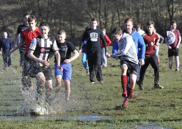 Action from a previous Alnwick Shrovetide football match.