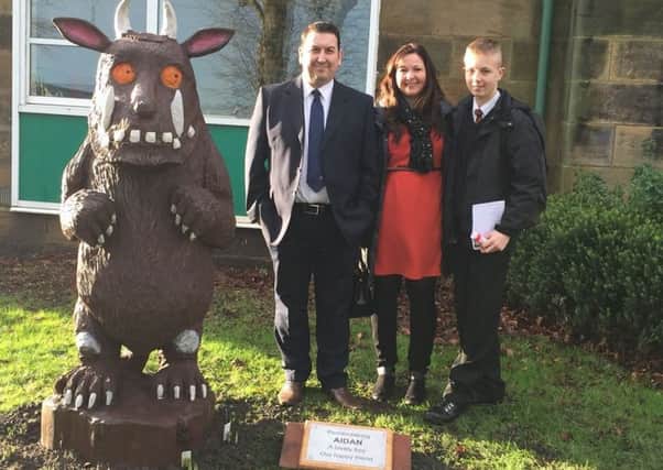 Aidan's father Karl, mother Vikki and brother Daniel with The Gruffalo at Barndale House School.