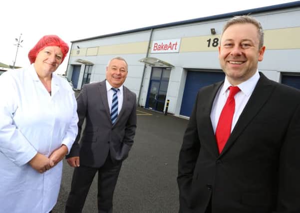 BakeArt factory manager Linda Lisle, left, and managing director Malcolm Hemmings with, centre, Lee Farrier, Archs head of estates.