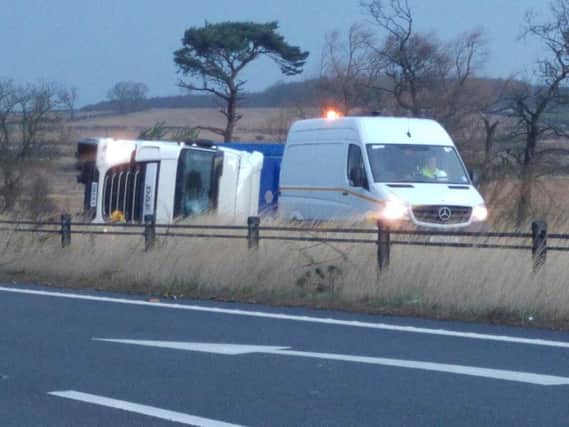 The overturned lorry on the A1 near Alnwick. Picture by Jane Coltman