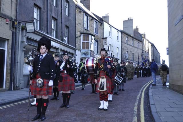The march through Alnwick marking the centenary of the Tyneside Scottish arriving in the town.