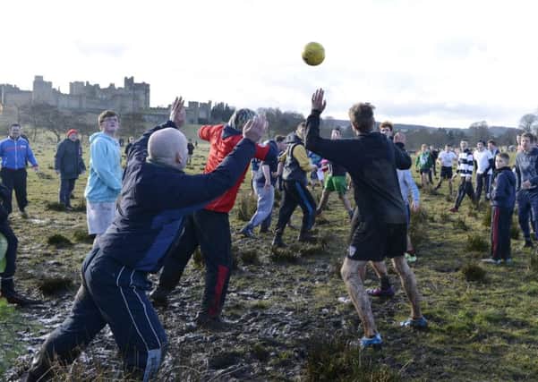 Action from last years Shrovetide football match in Alnwick. Picture by Jane Coltman