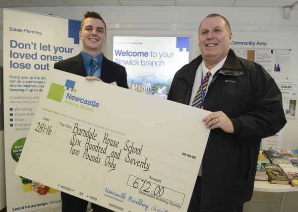 Barndale headteacher Colin Bradshaw (right) accepts the cheque from Stephen Burt at the Alnwick branch of the Newcastle Building Society.
Picture by Jane Coltman