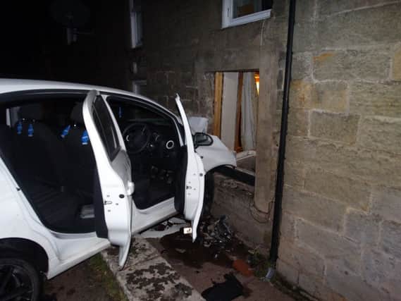 The car which crashed into the house.