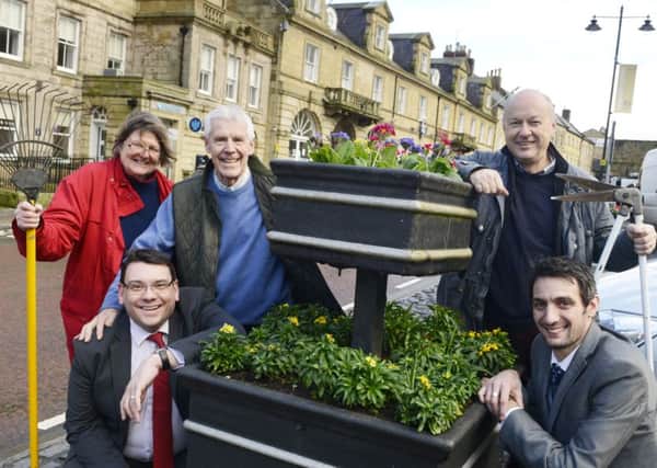 White Swan Hotel general manager James Thompson and operations manager Anthony Fyfe with and Carlo Biagioni, chairman of Alnwick Chamber of Trade  and Elizabeth Jones and Tom Pattinson from Alnwick In Bloom, announcing The Alnwick Raffle. Picture by Jane Coltman