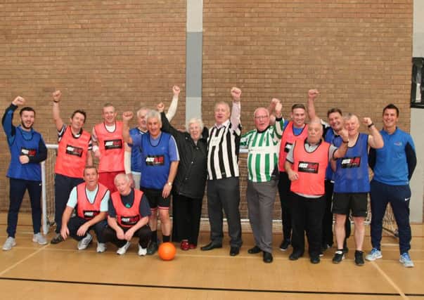 MPs Ronnie Campbell and Ian Lavery, Coun Val Tyler with Blyth walking football teams.