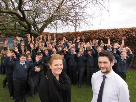 The current Year 7 pupils at Dr Thomlinson's CofE Middle School with deputy headteacher and head of English, Stephanie Whaley, and head of maths, Graham Russell.