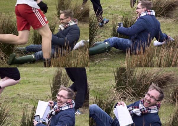 Gazette reporter James Willoughby falls over after tripping on a mound of grass while filming the action at today's Shrovetide football match. Picture by Michael Pearson.