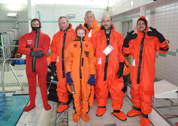 Members of a previous Introduction to Commercial Fishing Course doing the sea survival certificates at the pool in Alnwick.