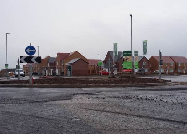 The road surface close to the Persimmon Homes development in Amble.