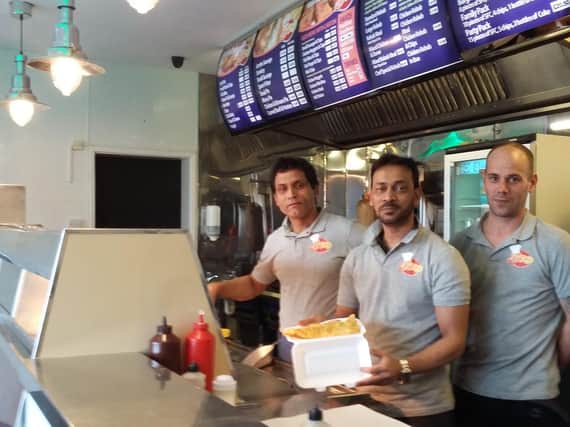 Staff at the recently reopened Barresdale Triple Diner, including Roy Uddin, centre.
