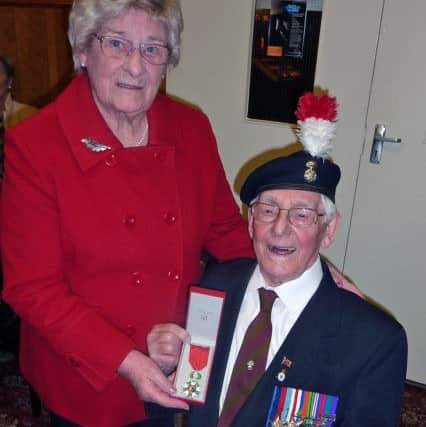 George Brewis shares the moment of receiving the Legion D'Honneur with his wife Ann.