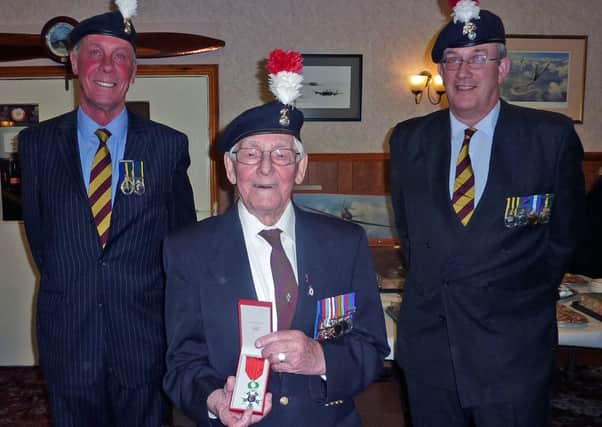 George Brewis proudly holding the Legion D'Honneur with, left, Major Alan Wall TD, president of the Alnwick branch of The Fusiliers Association, and,  right, Colonel Richard Jackson QVRM, who presented the award.