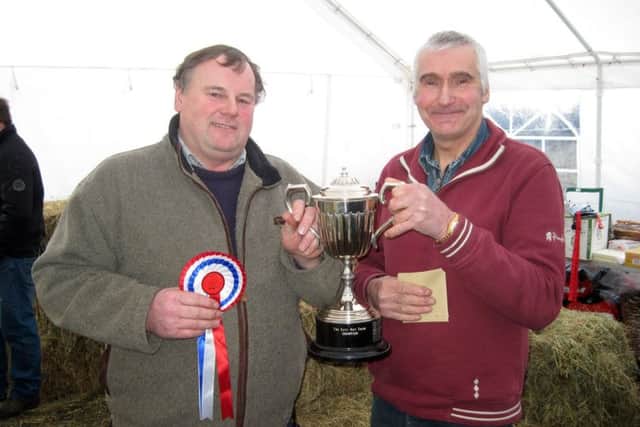 On Bale: Ian Harvey (left) collects  first prize from Simonside Hay Show's Hedley Heron.