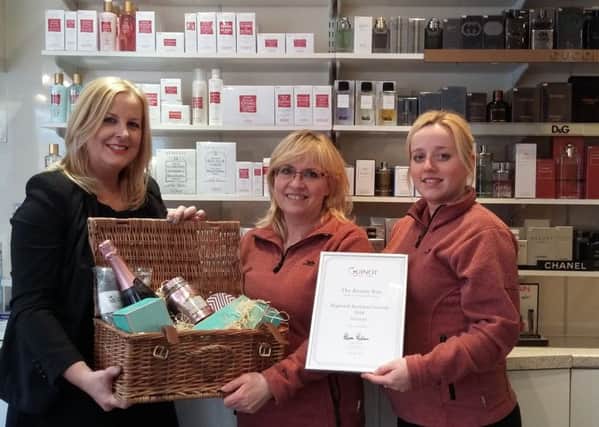 Fiona Rachel, from Guinot, and The Beauty Boxs Jane Atkin and Lucy Mallaburn, with the hamper and award certificate.