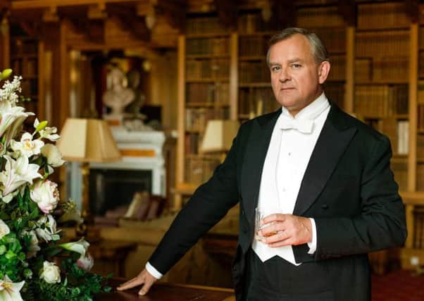 Hugh Bonneville, who plays the Earl of Grantham in Downton Abbey, pictured in the library at Alnwick Castle.