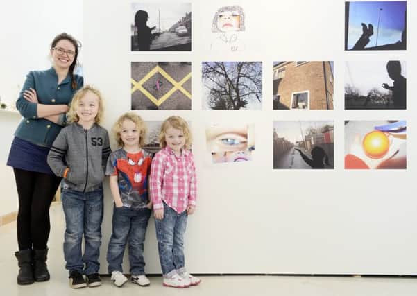 Artist Alice Myers with Logan, Jayden and Georgia McGarry from Newbiggin at Woodhorn. Picture by Jane Coltman