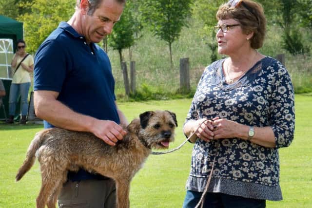 Robson Green with Lesley Gosling and border terrier Buster. Picture courtesy of ITV