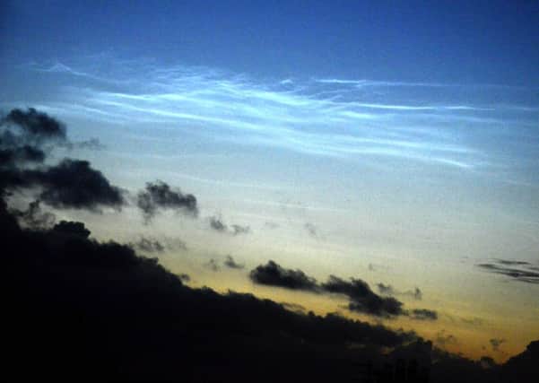 Noctilucent clouds seen by Jane Coltman in the early hours of Sunday morning above Alnwick. Noctilucent clouds are very different from normal weather clouds and shine only at night, after all the other clouds have left the skies. Their name literally means 'night shining'. Best seen in dark twilight towards the north, they are part of a very high polar cloud layer in the Earths upper atmosphere. Like conventional clouds, they are made of water ice  but heres where the resemblance ends. Noctilucent clouds are the highest clouds hovering above our planet: forming at altitudes of up to over 80km, they touch the edge of space itself. They appear in the northern hemisphere between late May and early August and  shine with an eerie, bluish, almost electric glow.