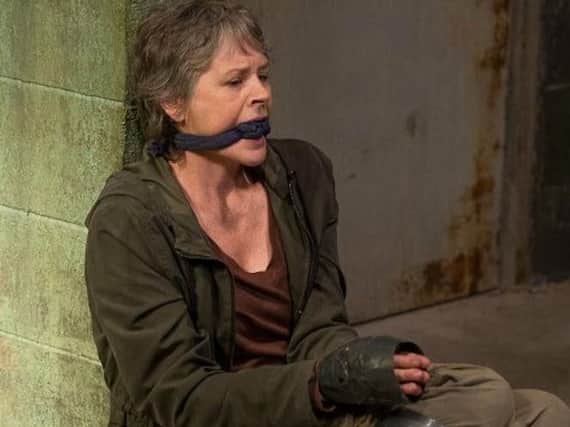 Carol taken hostage.