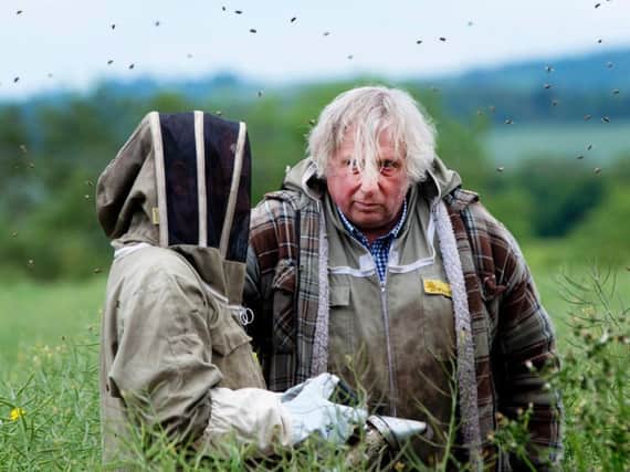 Robson Green in his beekeeping gear with Willie Robson at Chain Bridge Honey Farm. Picture courtesy of ITV