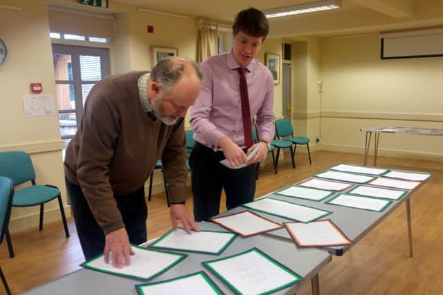 Lord Joicey and Gazette reporter Ben O'Connell judging the Young Writer competition entries.