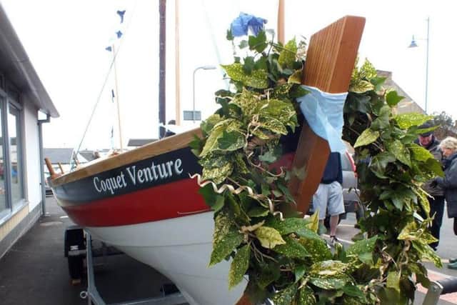 Coquet Venture with the blessing wreath on the front.