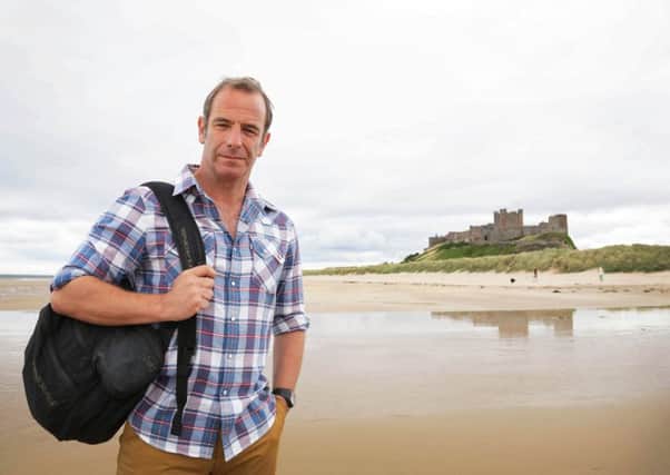 Robson Green on Bamburgh beach in the shadow of Bamburgh Castle where he forages in the rock pools for seaweed and limpets. Picture courtesy of ITV