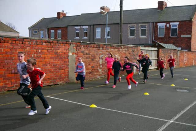 Pupils from Central Primary School take part in a sponsored run to raise money for Sport Relief.