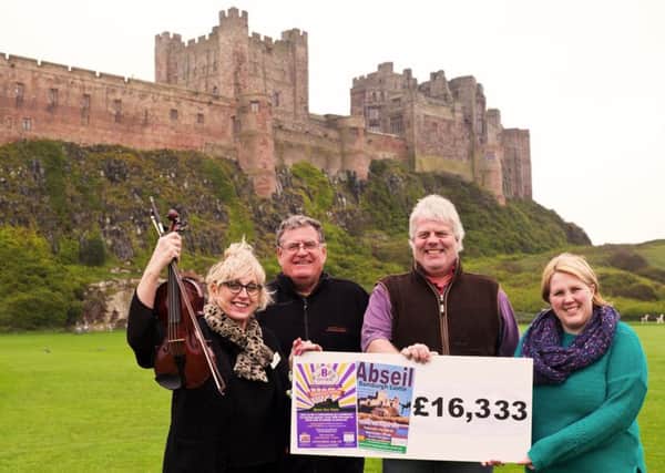 Julie Frost, from HospiceCare North Northumberland, Neil Forsyth, of Stay Northumbria, Francis Watson-Armstrong, and Emma Arthur, from HospiceCare with a cheque of more than Â£16,000.