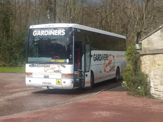 The Gardiners NMC coach parked outside the public inquiry.