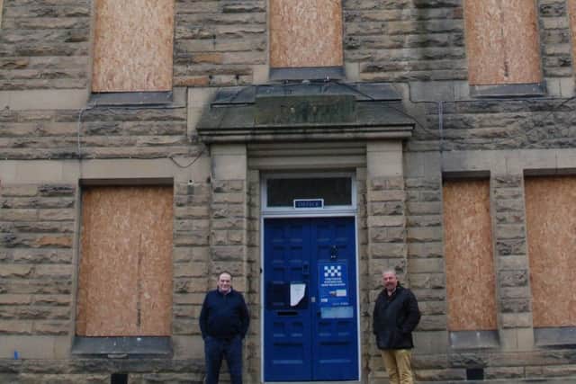 Ken Beattie and Coun David Clark outside the four-story building at the former Morpeth Police Station site.