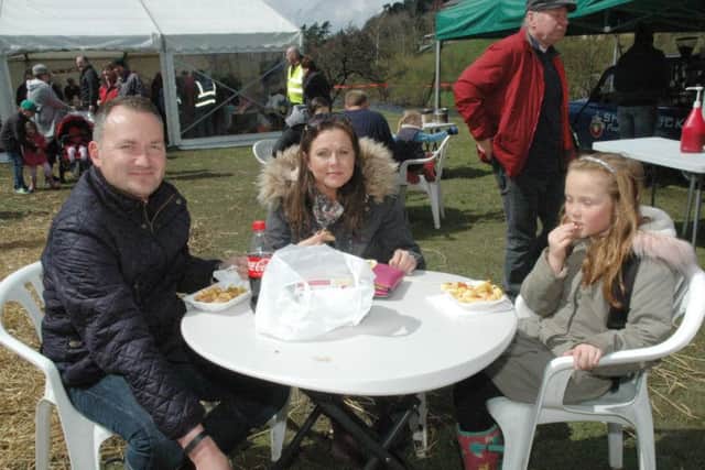 Anne Henderson, Robin Greener and Millie Greener, seven, from Alnwick, tuck in. Picture by Mary Scott