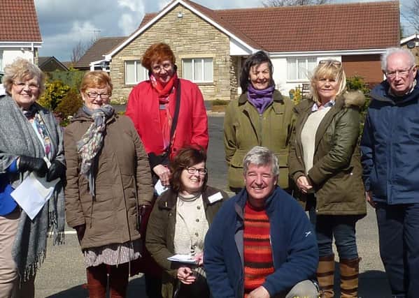 Judges and members of Warkworth in Bloom on Morwick Road. Picture by John Howie