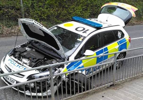 The police car that was damaged after colliding with railings in Curly Kews this afternoon. Picture by Shaun Johnson.