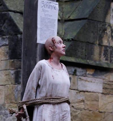 Actress Laura Frances Morgan playing Joan of Arc just before the fire was set alight. Picture by Margaret Whittaker