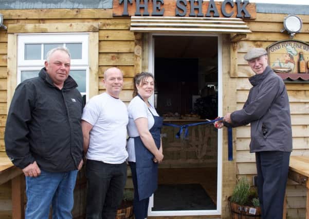 Jack Charlton opens The Fish Shack at the Sea Quest in Amble, with Davey Buddle, Martin Charlton and Ruth Charlton.
