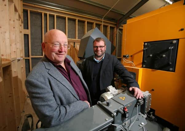 Henry Lonsdale Charitable Trusts John Mallinson (left) and re:heats Ben Tansey with the new biomass boiler at Rosehill.