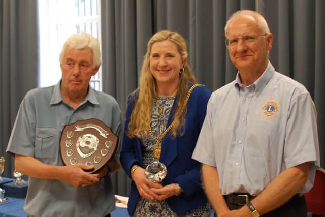 Mike Bateman, left, with Morpeth Mayor Alison Byard and Chris Offord of Morpeth Lions Club. Picture by Bob Robertson.
