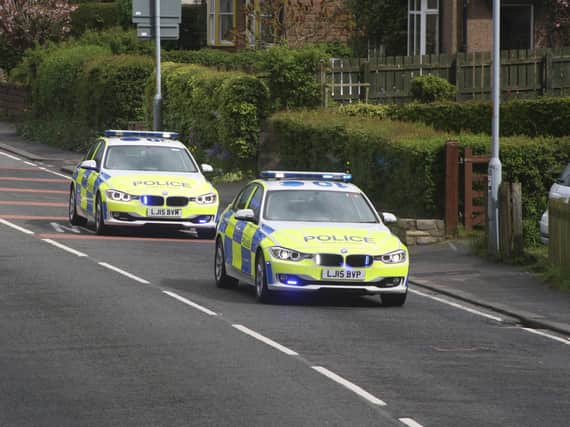 Police on their way to the scene of the accident. Picture by Jonathan Winton