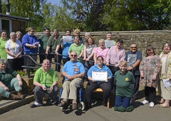 Service users and staff at the Pottergate Centre in Alnwick celebrate their success.
 Picture by Jane Coltman
