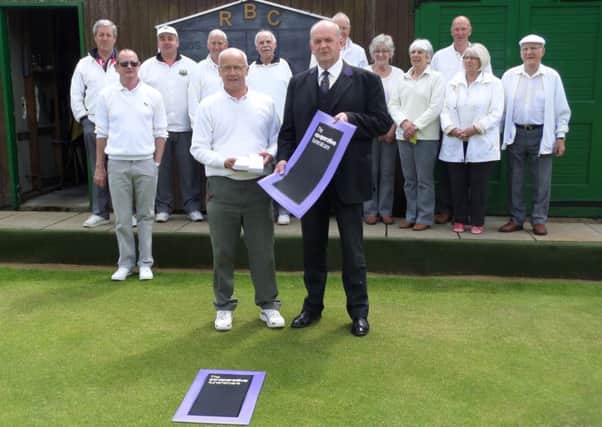 Prior to the Rothbury Bowling Club annual Jessie Heron pairs competition, Christopher Foggon the Director of Co-op Funeral Care, Rothbury, presented the club President David Bolton with mats and score cards.