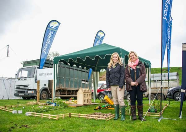 Emma Fairbairn and Kirsty Meek of YoungsRPS show off their miniature farm at the 2015 Children's Countryside Day.